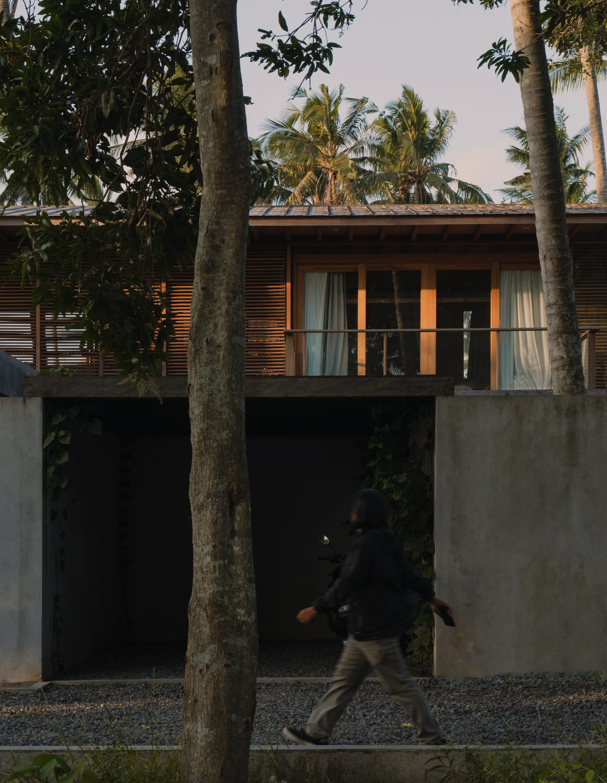 Front elevation of Rumah Amadangi with carport and bedroom in the back